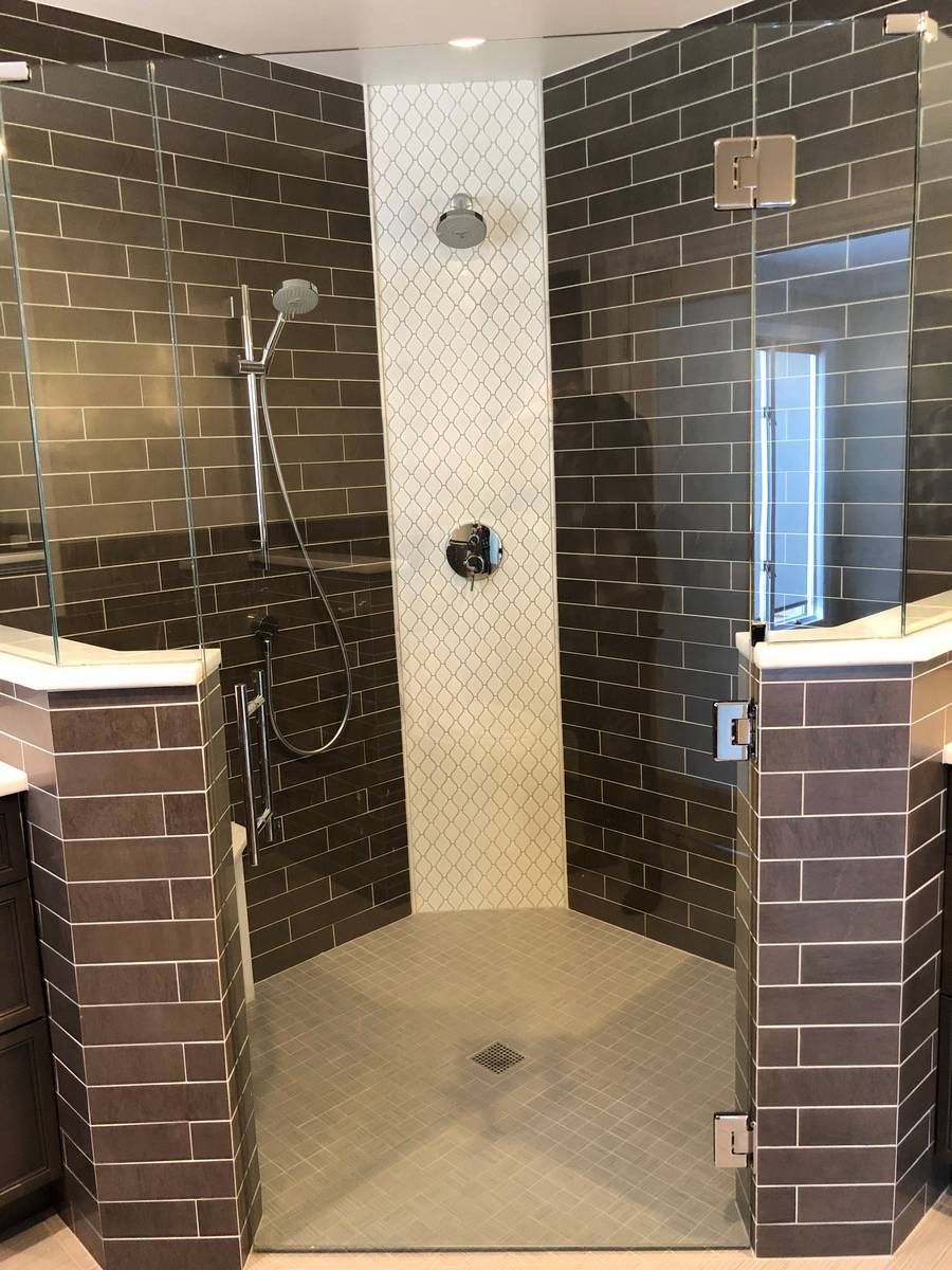 Walk-in shower remodel with brown subway tile and arabesque mosaic accent